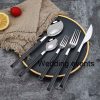 Stainless steel cutlery with black wood handle
