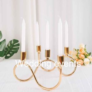 Wavy gold metal candelabra