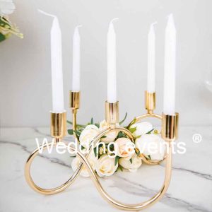 Wavy gold metal candelabra